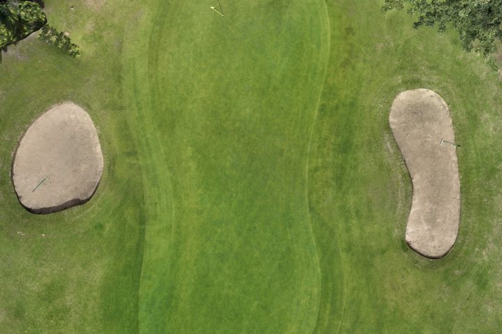 A golf green with two bunkers in the Terravect viewer, rendered in true colour: an even carpet of turf with no obvious variation across it.